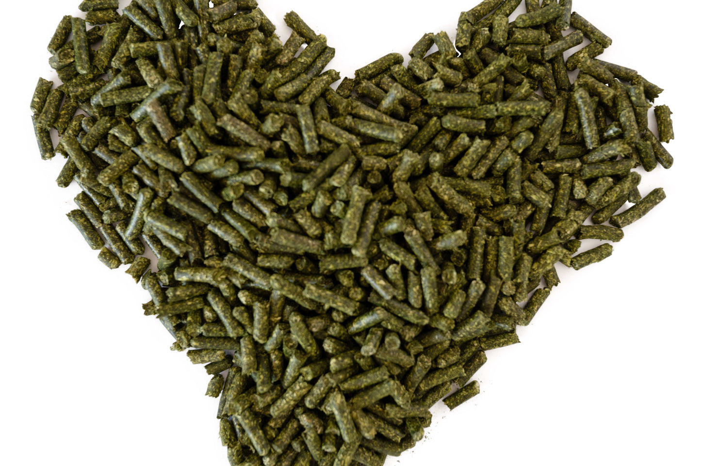 Heart-shaped pile of green pellets