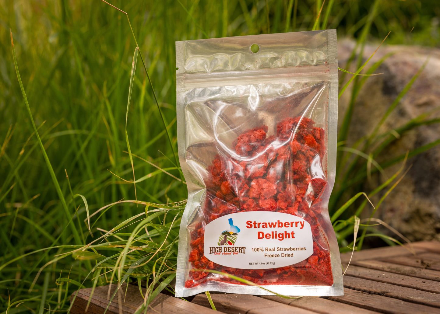 Packaged strawberry product with a label on a natural background