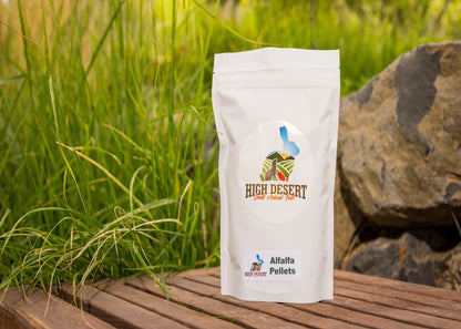 High Desert Alfalfa Pellets package on a wooden surface with grass and rocks in the background