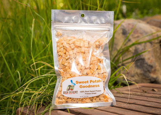 Package of High Desert Sweet Potato Goodness on a wooden surface with grass in the background